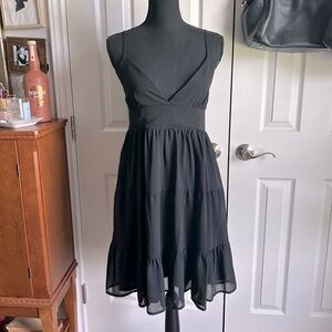 The Sweet Collective black spaghetti strap babydoll ruffle tiered mini dress